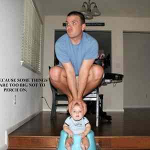 Obrázek 'Man Perches on Babys Head'