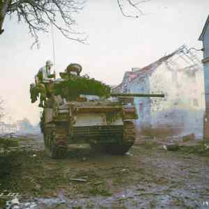 Obrázek 'Sherman tank firing to smoke out a German field entrenchment'