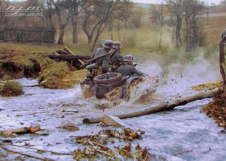 Obrázek German Wehrmacht soldiers aboard a BMW motorcycle and side car crossing a stream