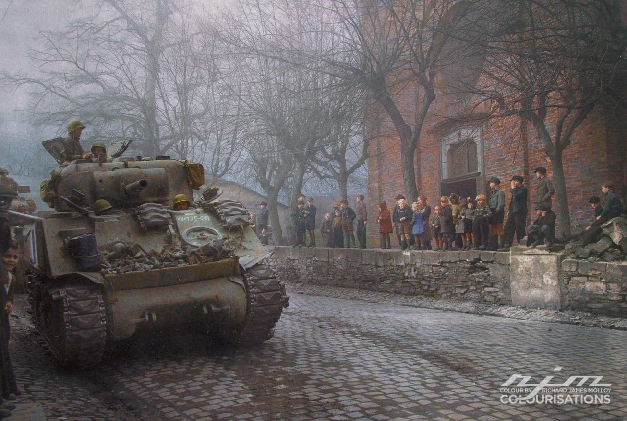 Obrázek M4 75 tank passing through a town in Europe somewhere